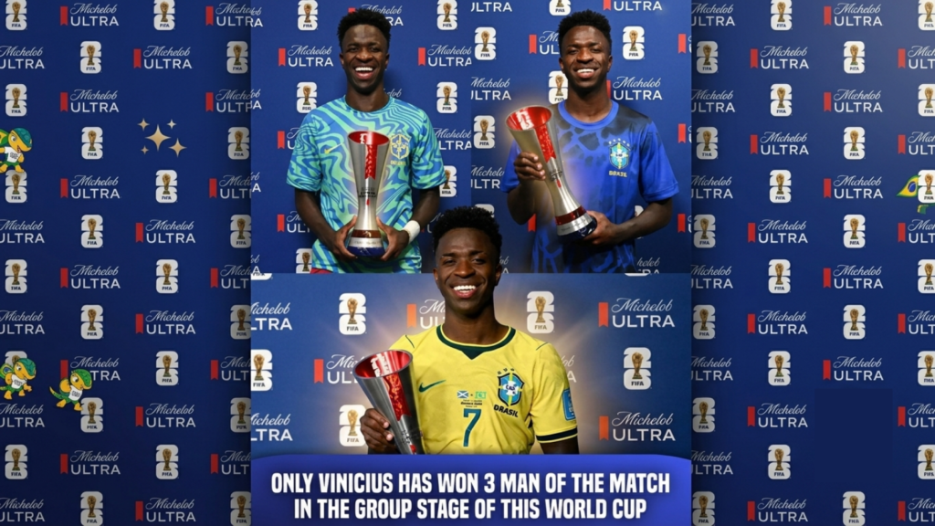 Vinicius Jr. smiling while proudly holding his three separate red and silver FIFA World Cup Man of the Match awards