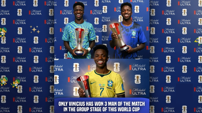 Vinicius Jr. smiling while proudly holding his three separate red and silver FIFA World Cup Man of the Match awards